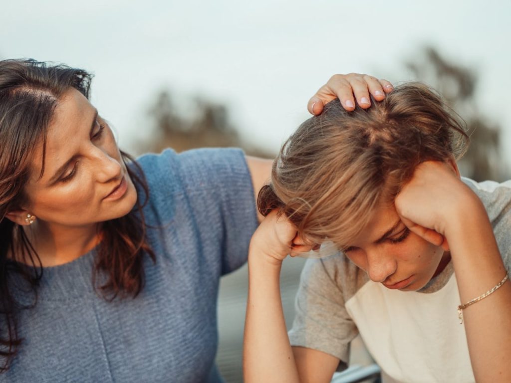 mother with her teenage son being kind and showing empathy