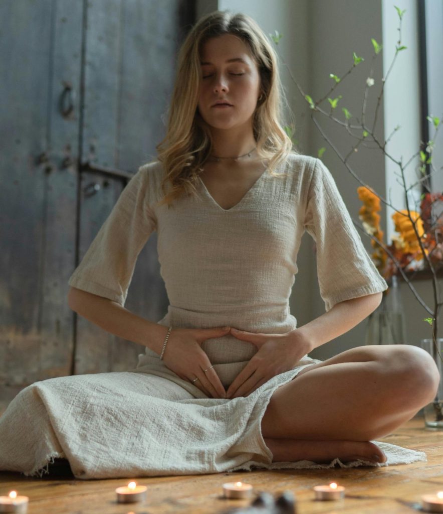 a woman practicing meditation to embrace all her emotions for authentic living and personal growth
